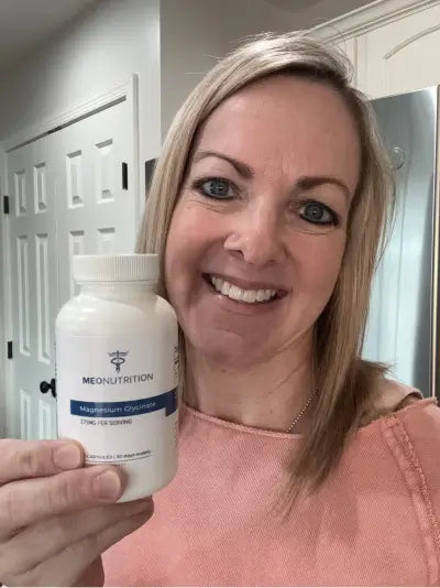 Woman holding Meo Magnesium Glycinate
